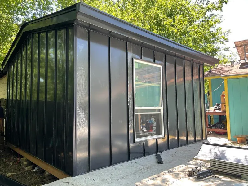 Black standing seam metal wall panels for Roof Inspection in Grapevine